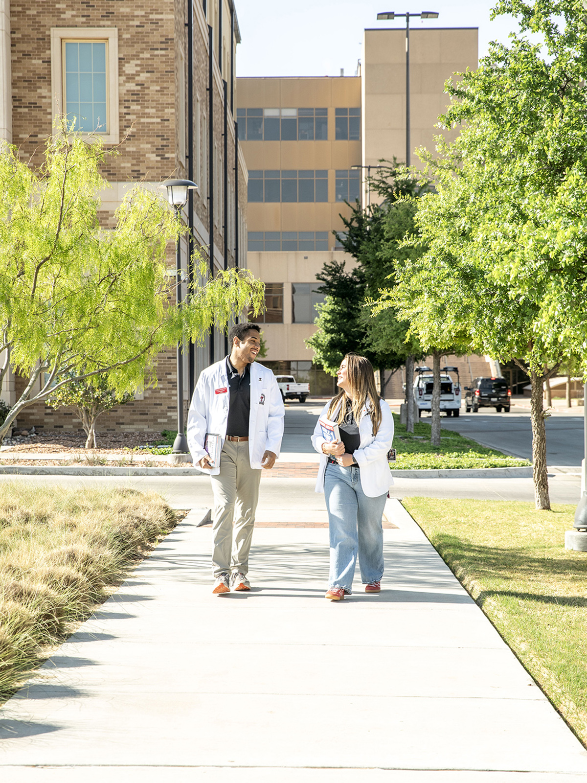 TTUHSC Lubbock students walking on sidewalk outside