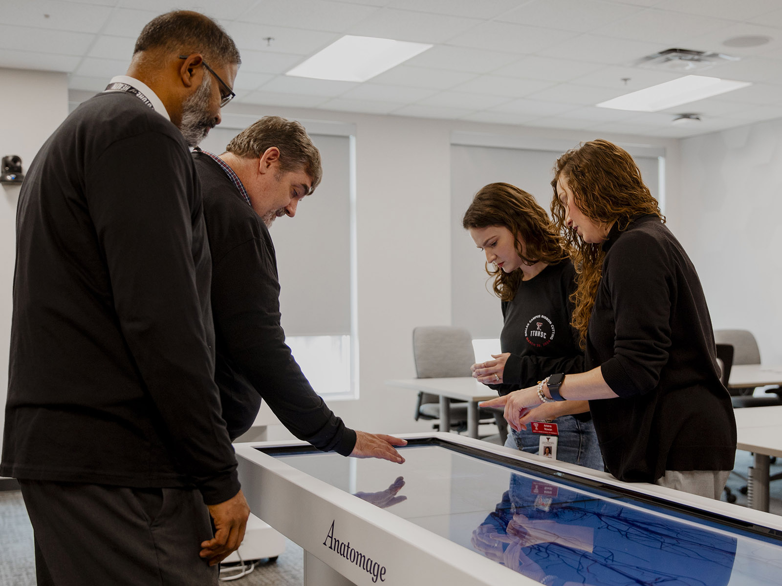 TTUHSC Dallas Mansfield simulation screens looking at human anatomy graphics.