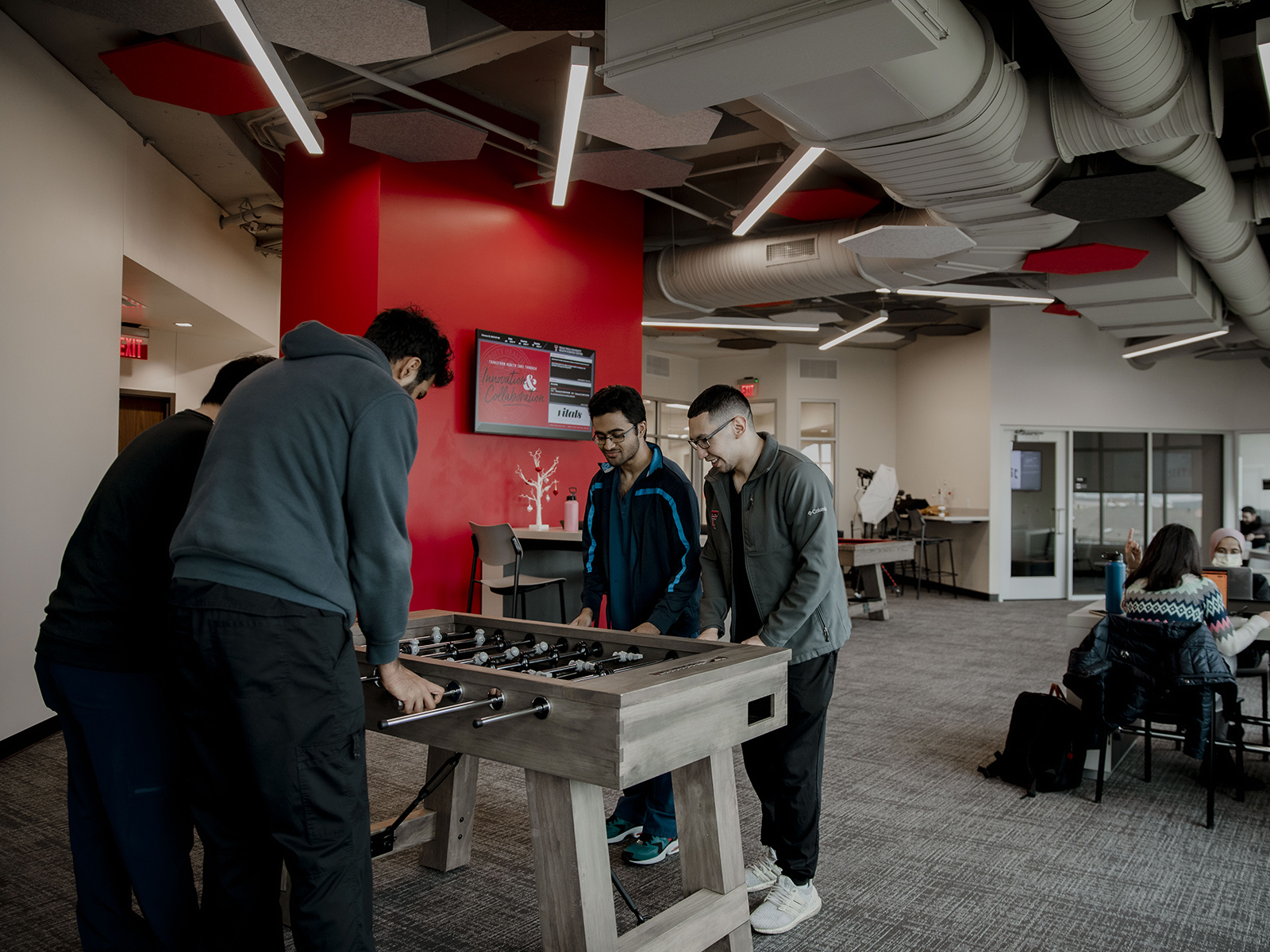 TTUHSC Dallas/Mansfield students playing games in lounge.