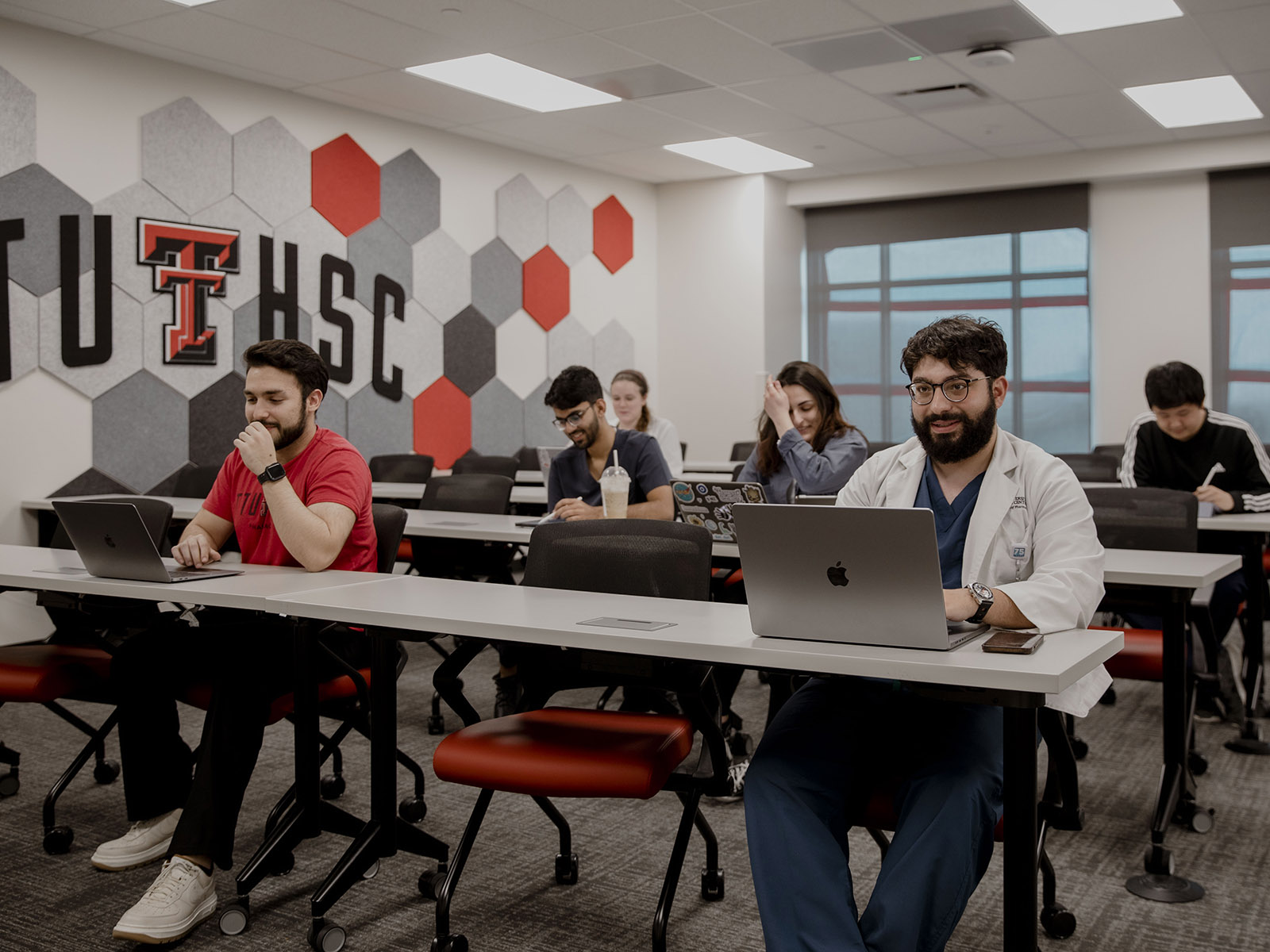 TTUHSC Dallas/Mansfield students in a large classroom sitting at tables