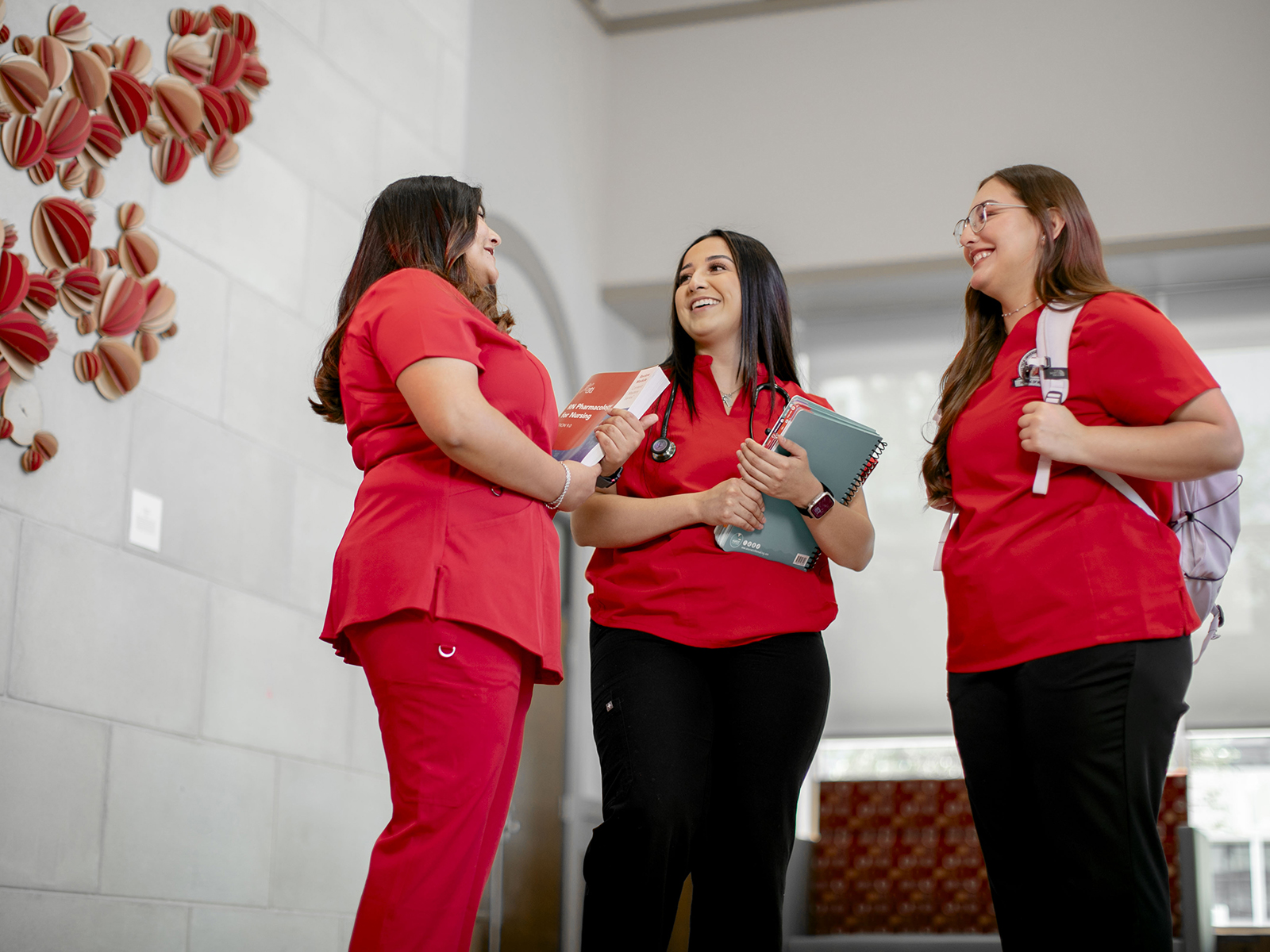 TTUHSC Odessa nursing students standing together inside a large open area