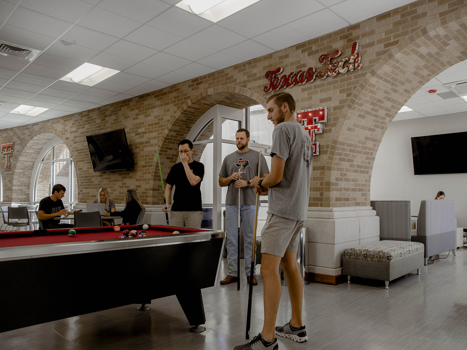 TTUHSC Amarillo students playing pool in the lounge.