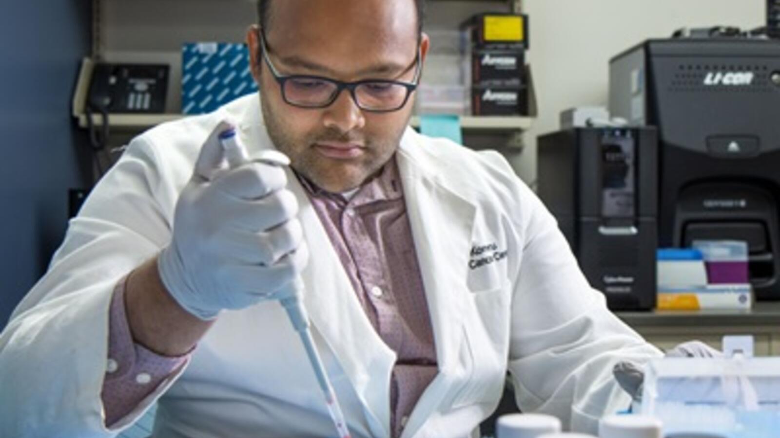 Balakrishna Koneru, Ph.D., working in a lab