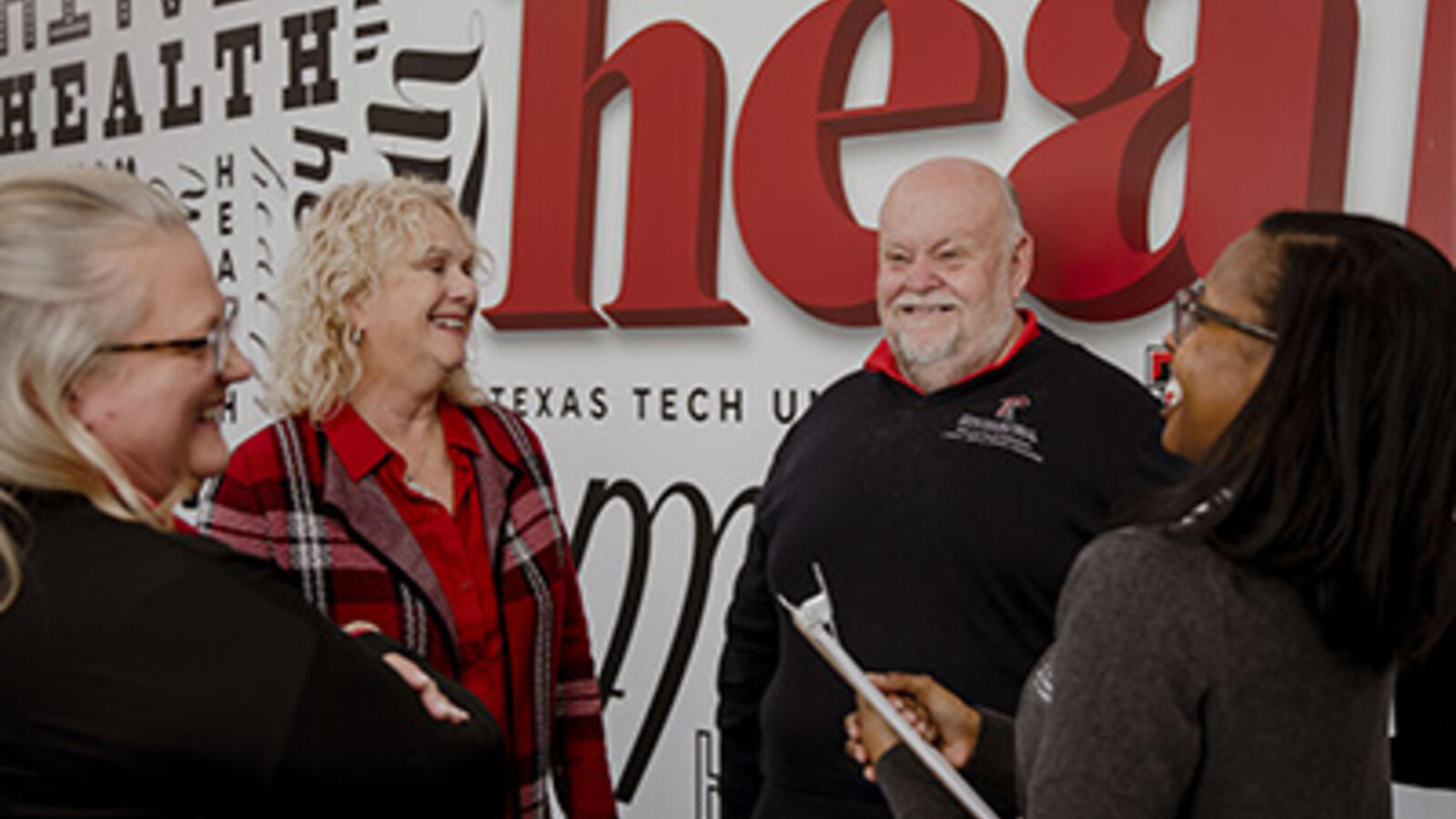 health professionals conversing at TTUHSC