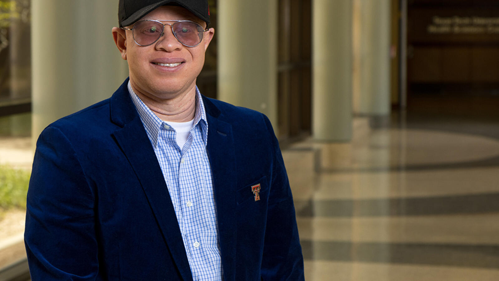 Duke Appiah, Ph.D. standing in the hallway at TTUHSC