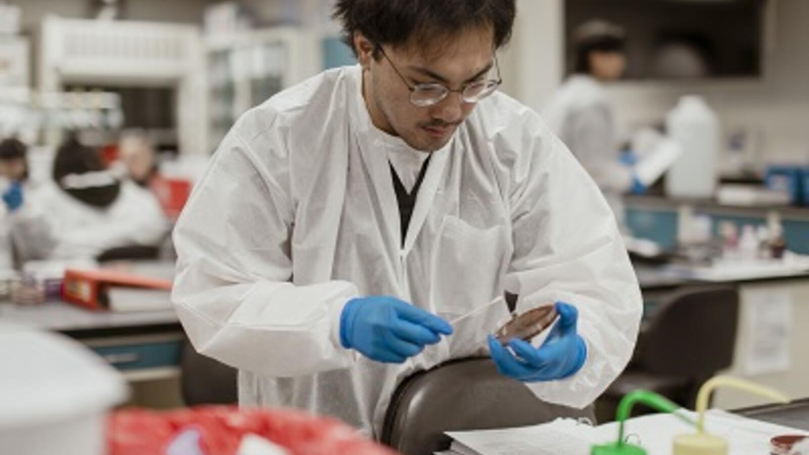 man working in lab with lab equipment