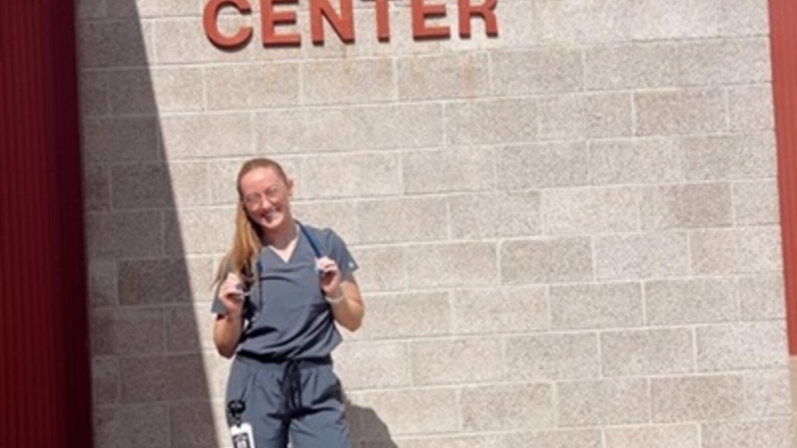 PA student standing in front of community center building