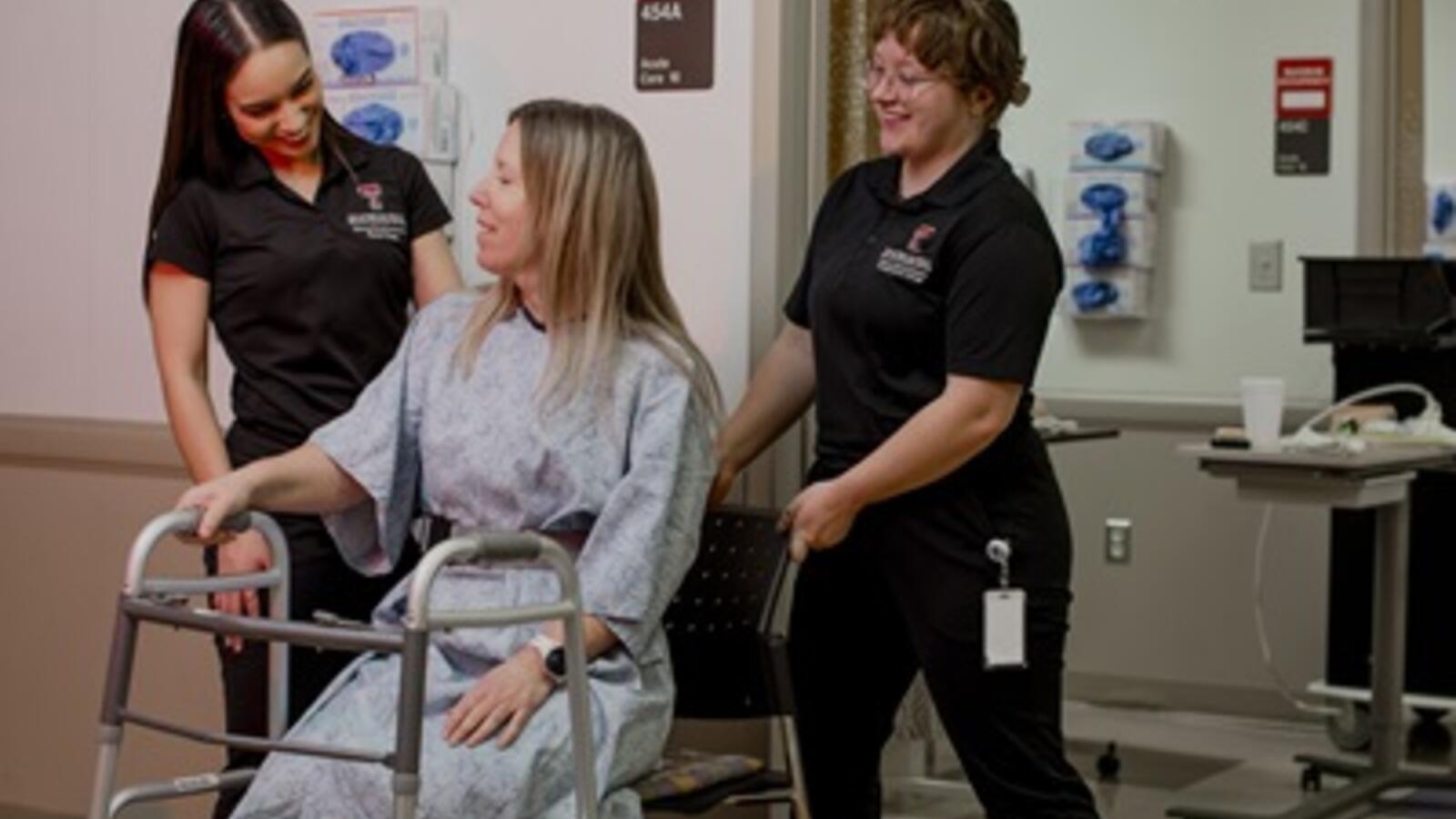 Students gaining health care experience in the SIM center