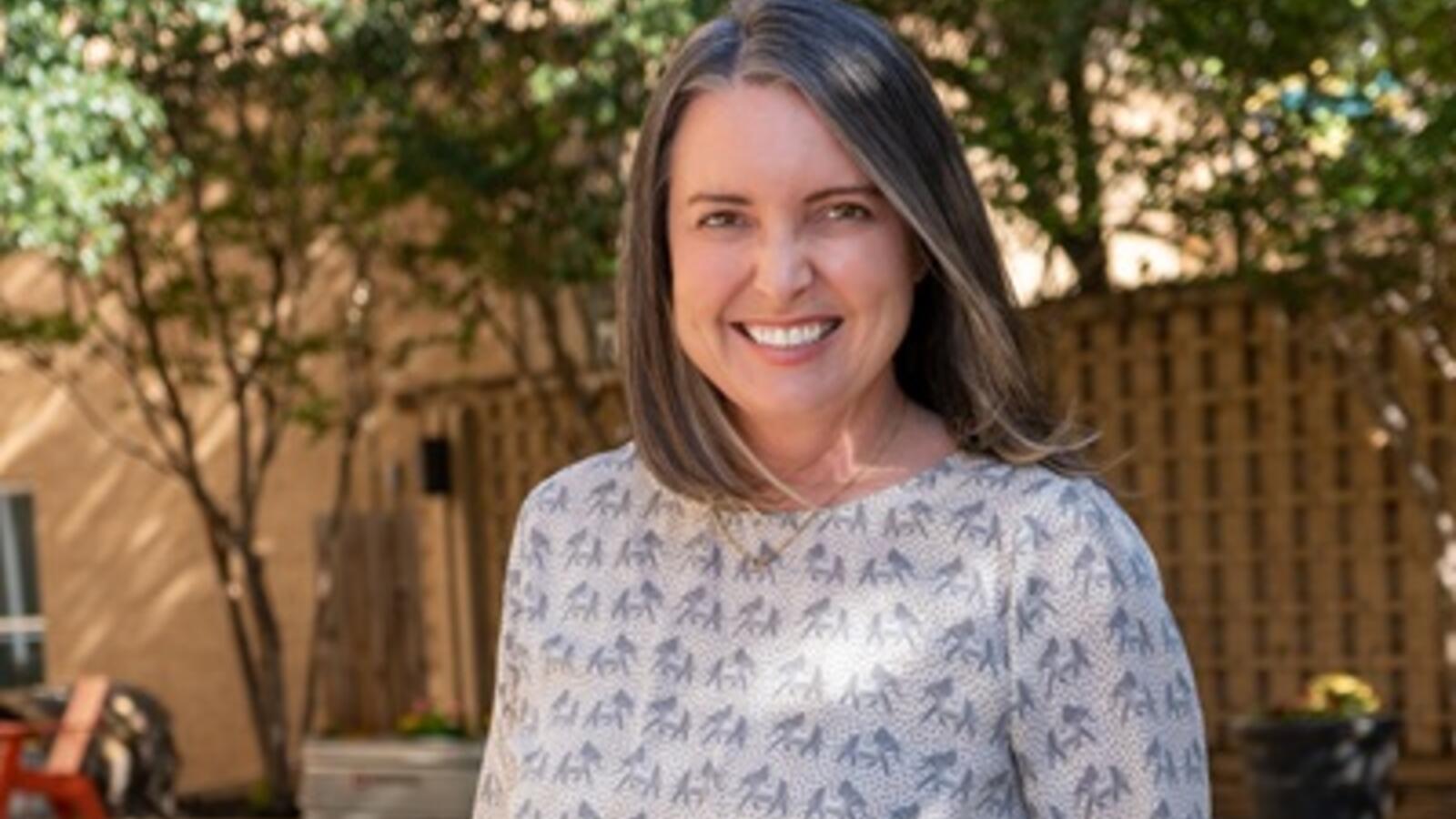 Sarah Mallard Wakefield, M.D., smiling outdoors