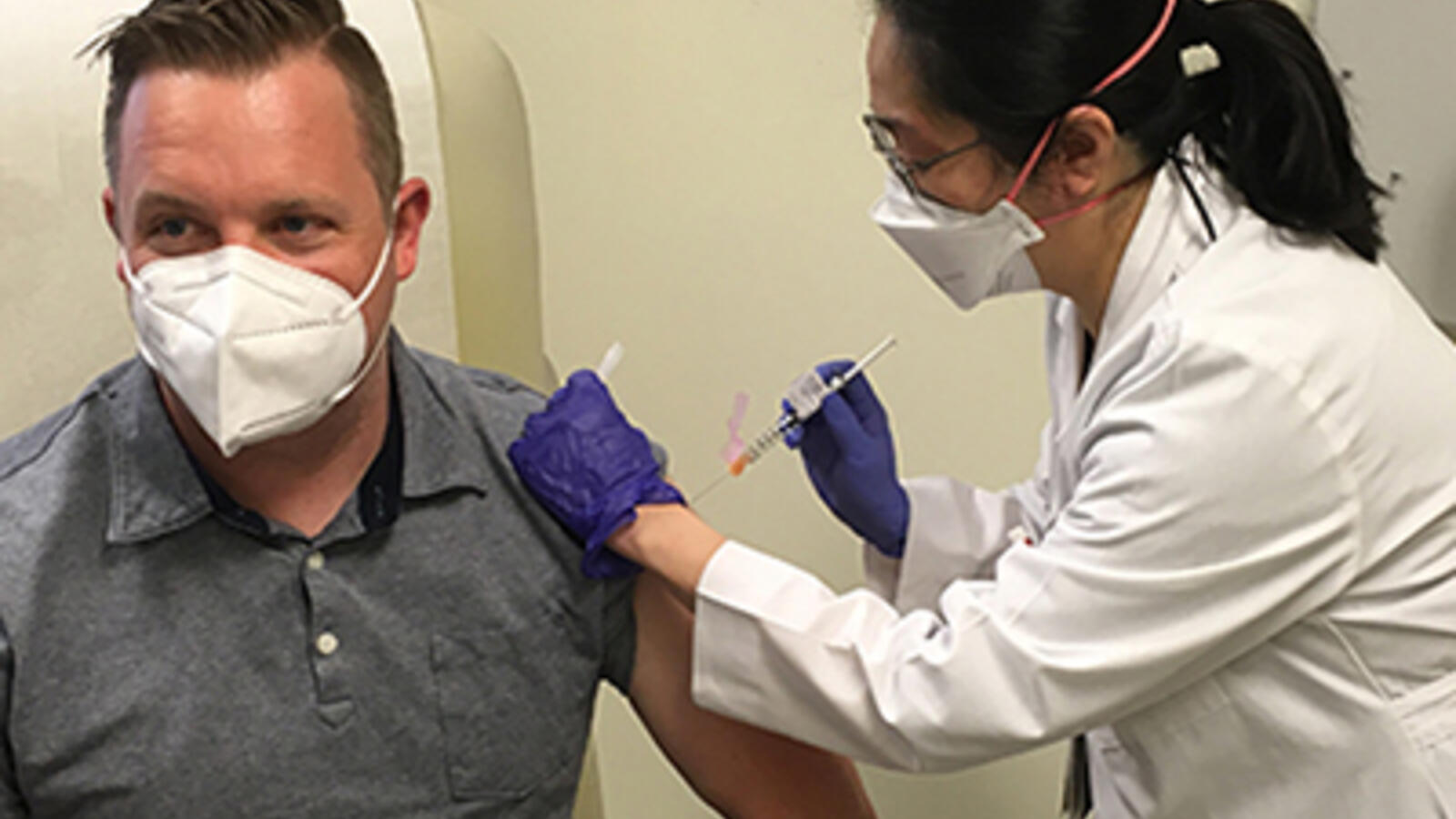 Participant in clinical trial receives vaccine