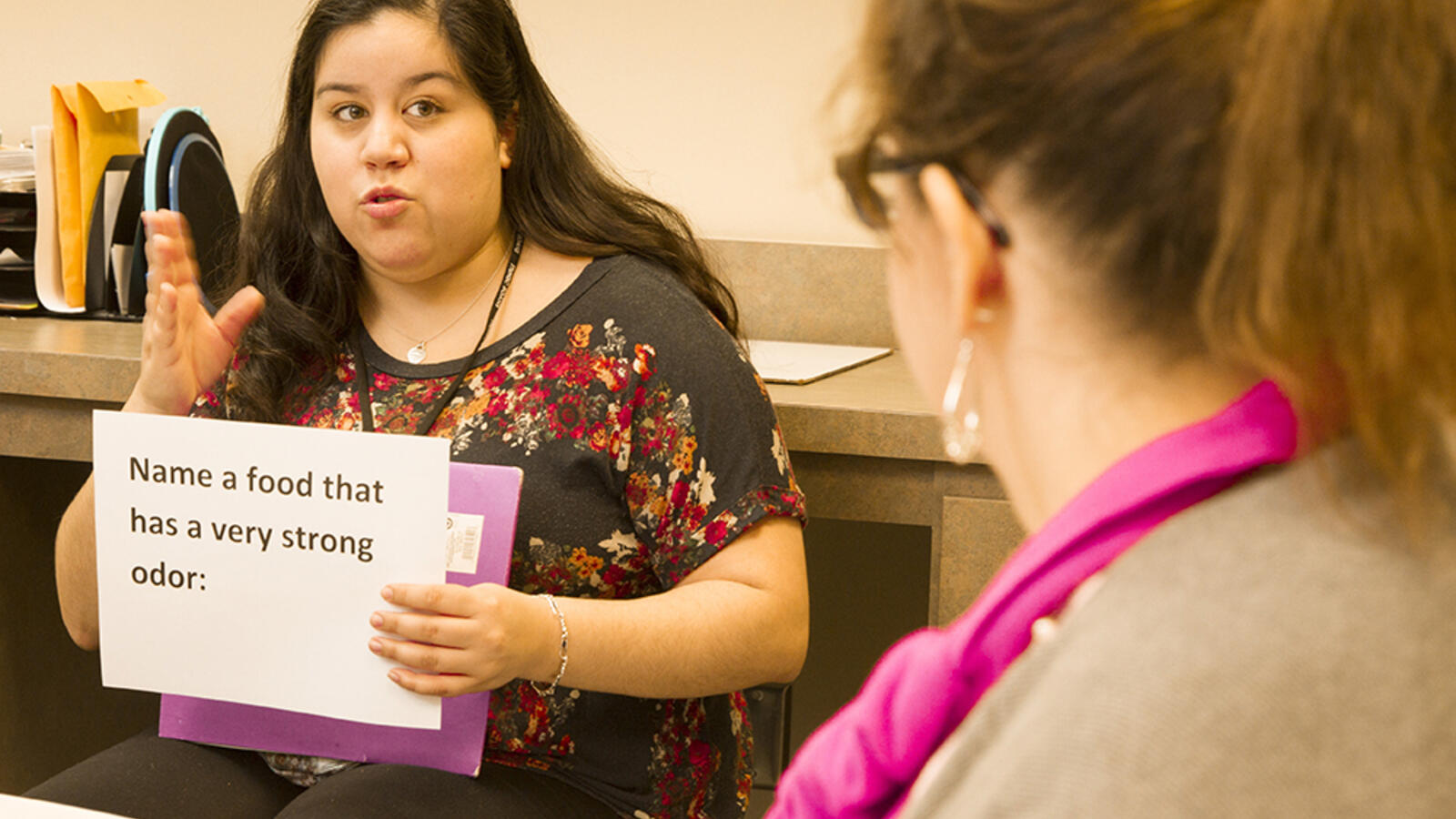 woman in the speech language hearing services department working with an aphasia patient
