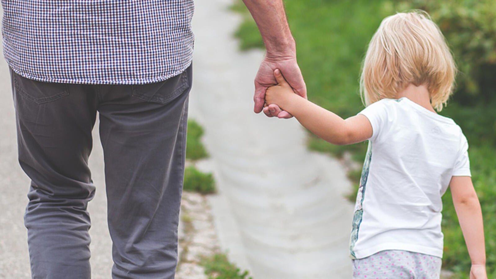 man on a walk with child