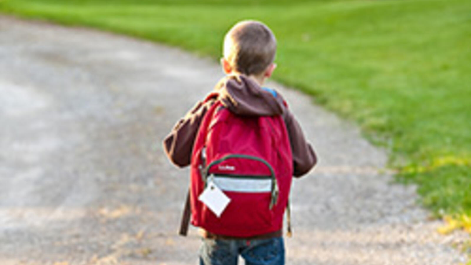 Child walks with backpack