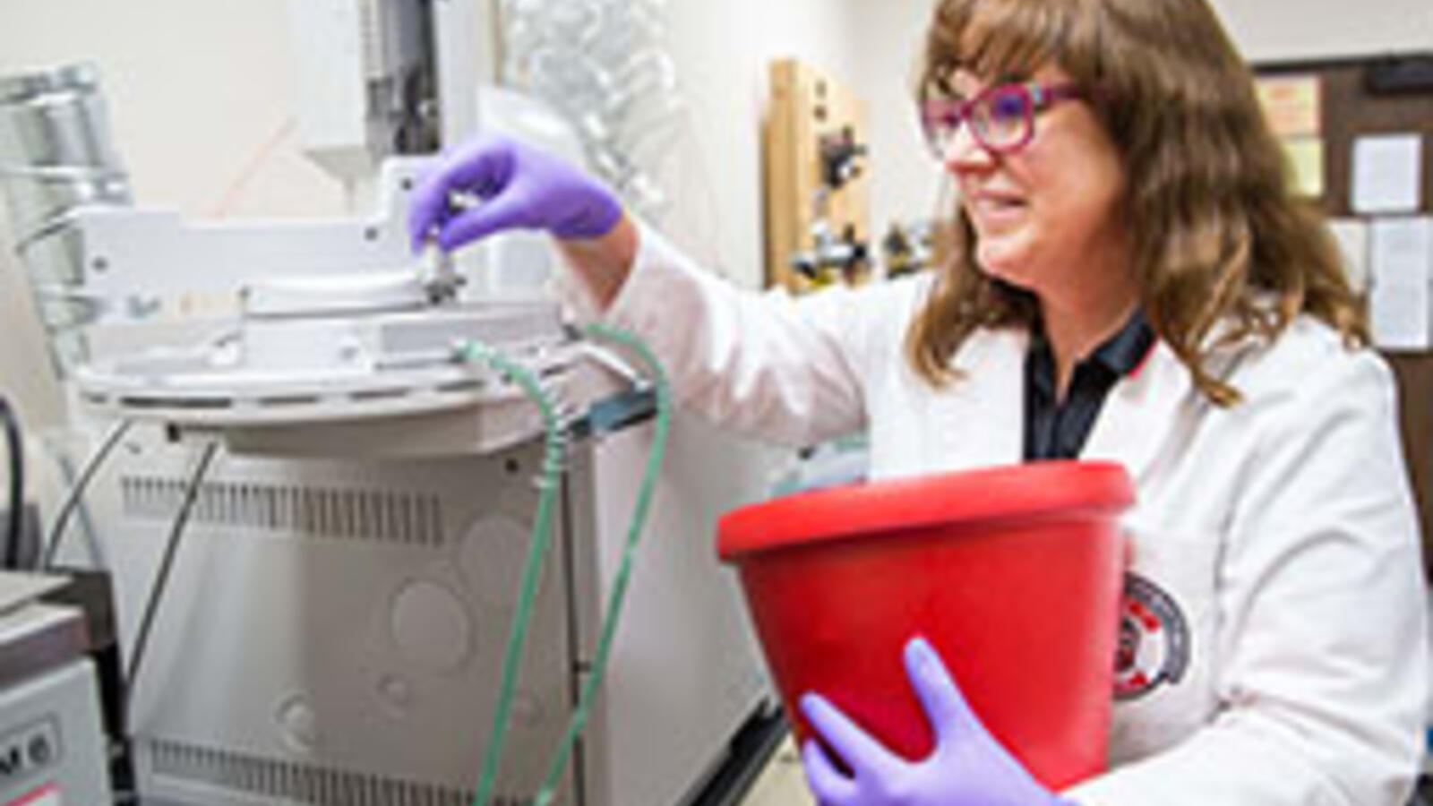 Susan Bergeson, Ph.D. working in a lab