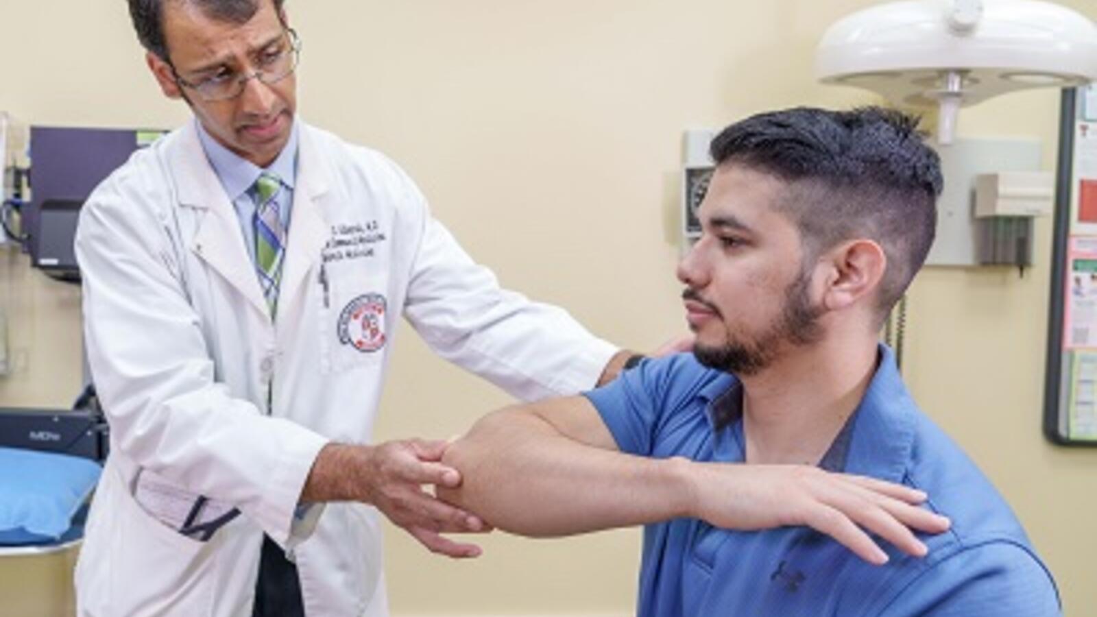 David Edwards, M.D., performing an exam on a patient
