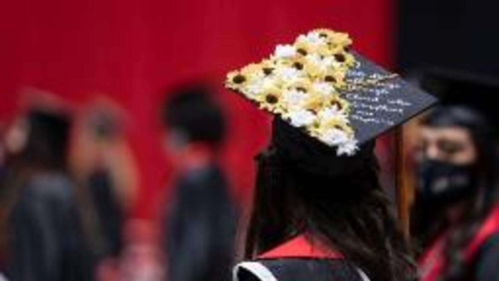 decorated graduation cap during on woman graduate's head