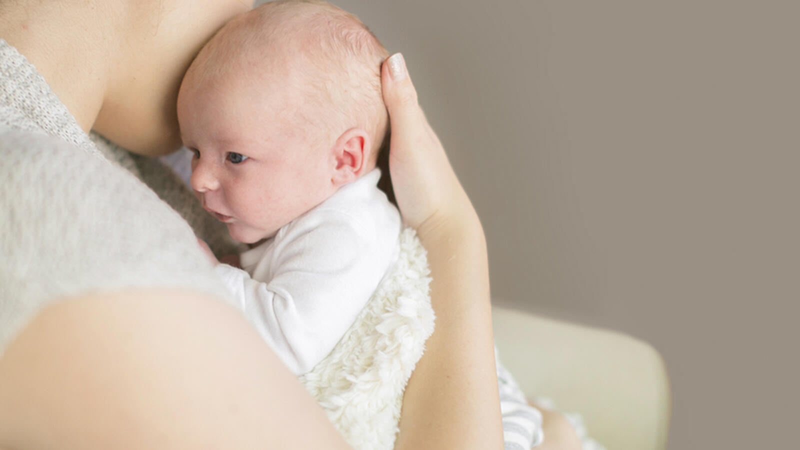 woman holding a newborn baby