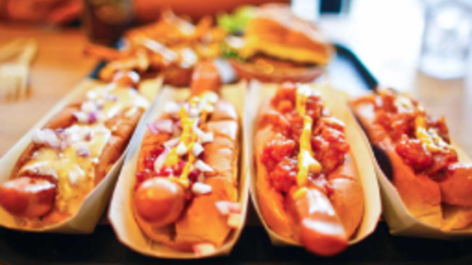 Plate of hot dogs covered in chili.