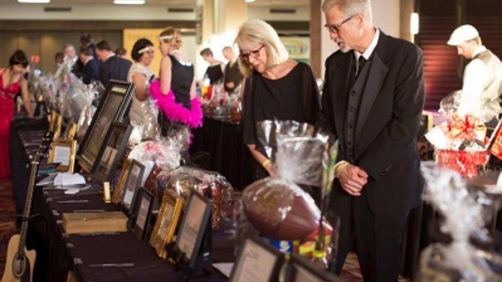 individuals participating in silent auction