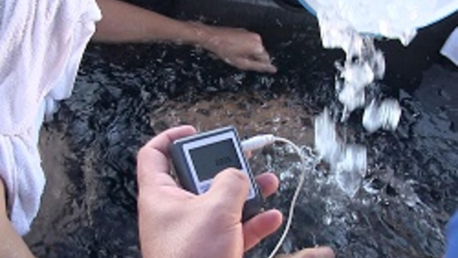 athletic trainers giving a patient an ice bath