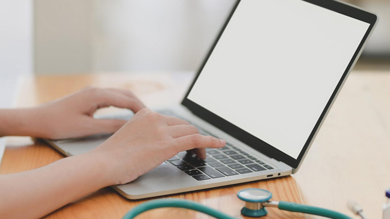 nursing student studying on laptop