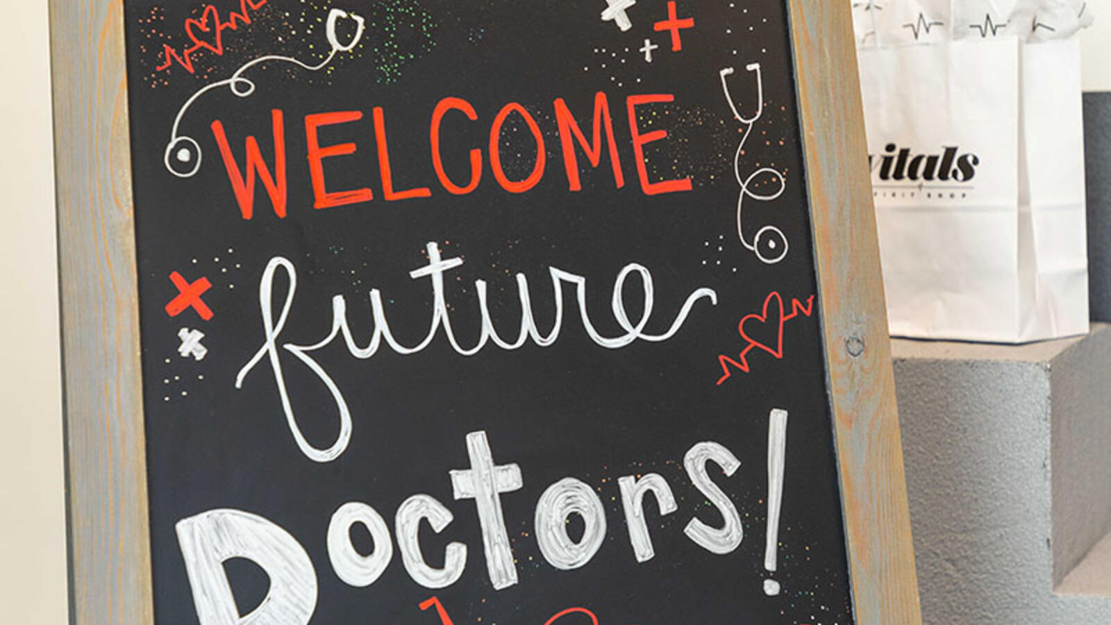 chalk sign that reads "welcome future doctors!"