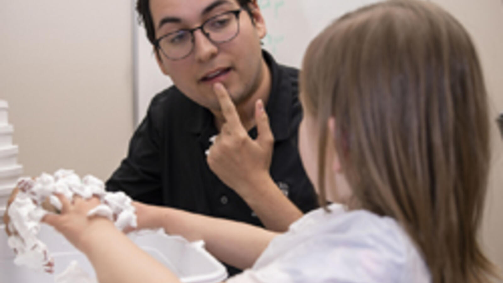 Speech, Language and Hearing Specialist working with a patient.