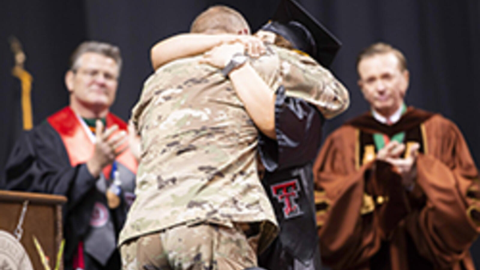 Nursing student hugs military father