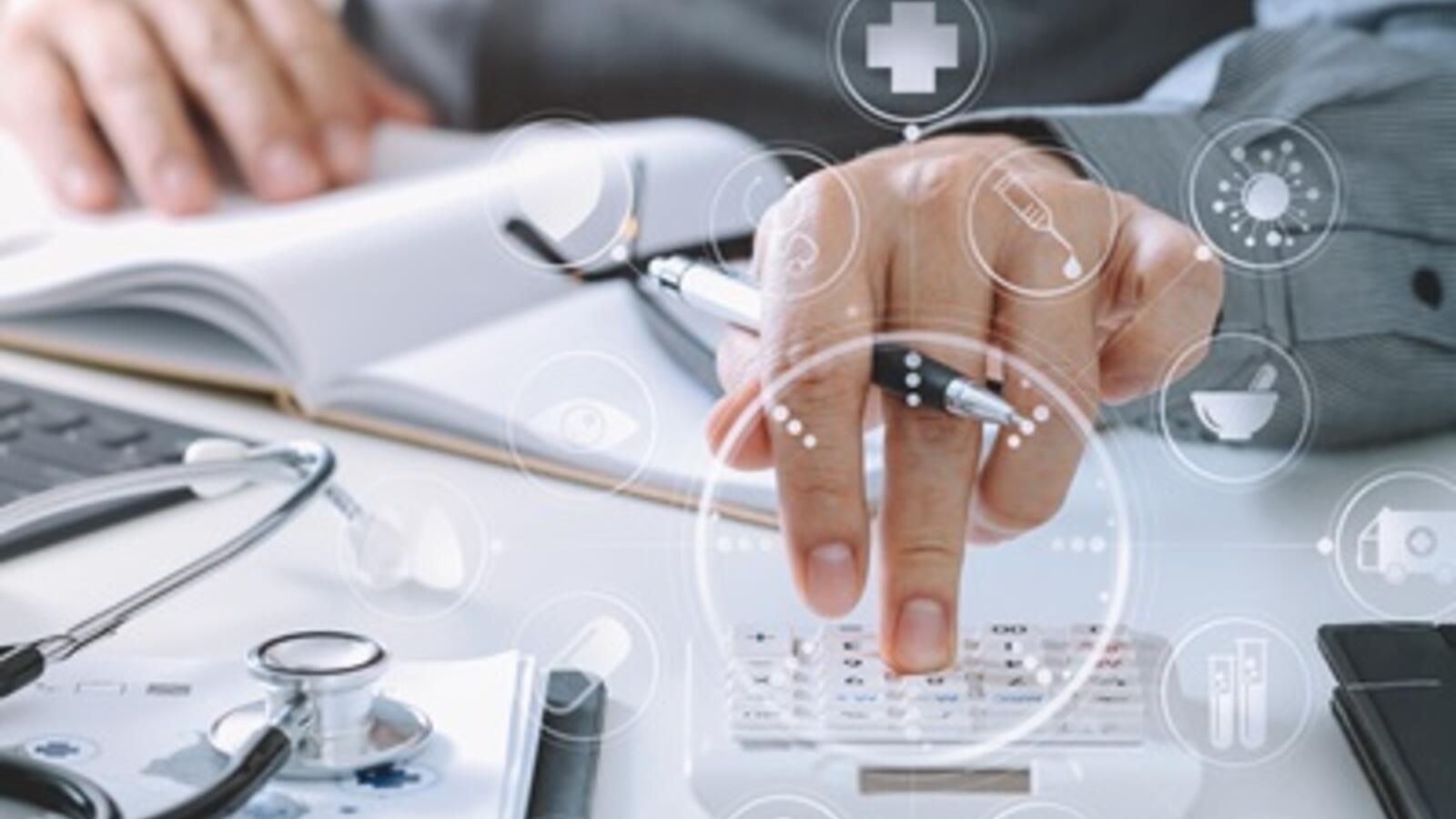 close up photo of hands using a calculator in a corporate setting