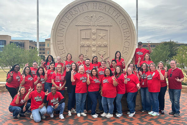 Staff Senate group photo in front of seal