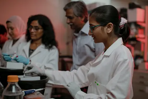 Pharmacy researchers conducting experiments in a laboratory.