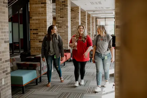TTUHSC students walking inside of an Abilene campus building.