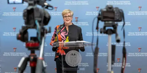 TTUHSC President Lori Rice-Spearman speaks at a podium during a recorded press event.
