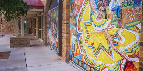 Colorful mosaic mural outside the Larry Combest Community Health & Wellness Center.
