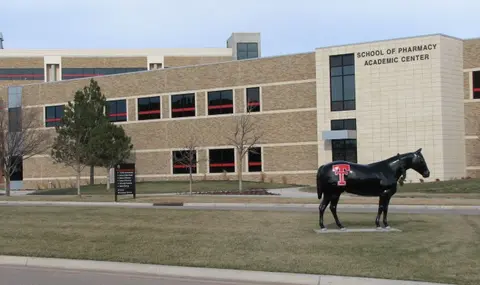 TTUHSC School of Pharmacy Academic Center and horse statue in Amarillo.