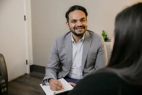 Counselor speaking with a client during a counseling session.