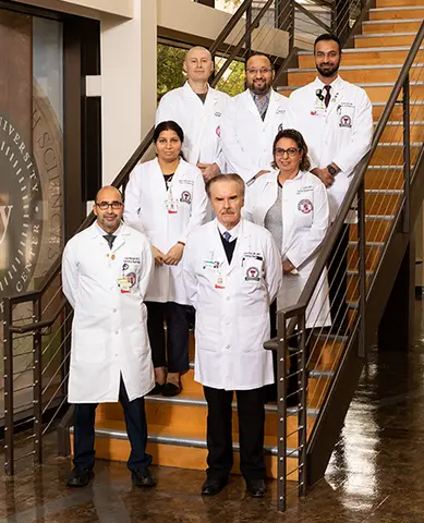 Group photo of Lubbock Dept. of Pathology faculty gathered on a staircase.