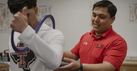 Edgar Garza working with an athlete
