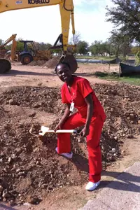 Nursing students and faculty helped move the first few shovels of dirt in the new building's construction.