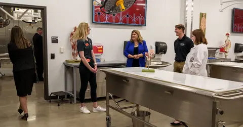 People tour an anatomy lab.