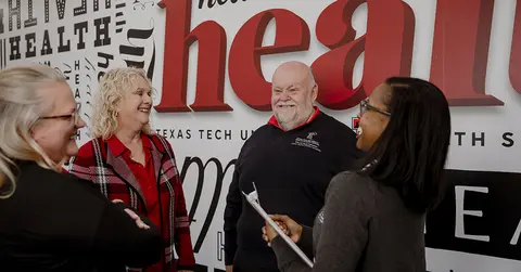 health professionals conversing at TTUHSC
