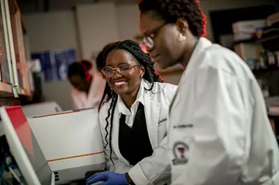 two women in a lab setting