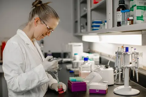 Dr. Guindon working in a lab setting
