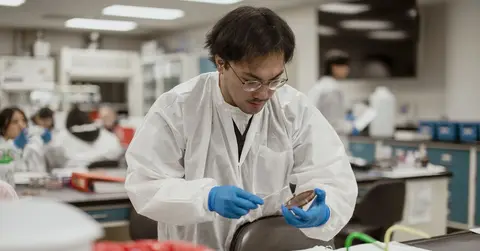 man working in lab with lab equipment