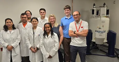  Nuclear Magnetic Resonance core with group of students