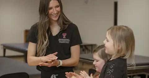 woman working with children 