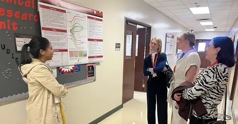 Student giving poster presentation for Student Research Day in Amarillo