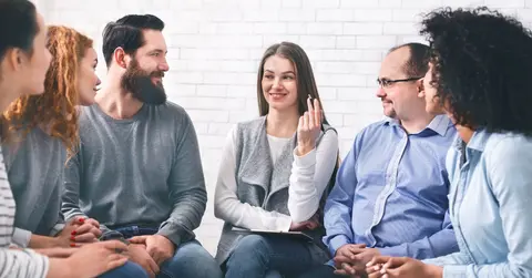 people sitting and talking in a professional environment