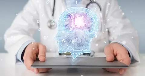 hands holding a tablet with an illustration of a holographic brain projected over it