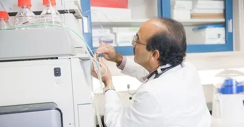 Awasthi tests experiment using equipment